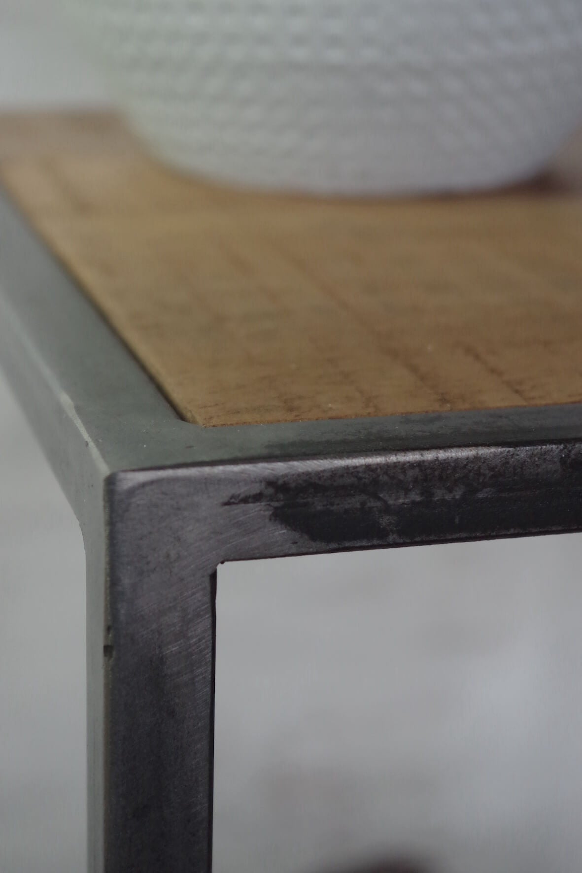 Saw Cut Nest of Two Tables made from metal and solid wood close up detail